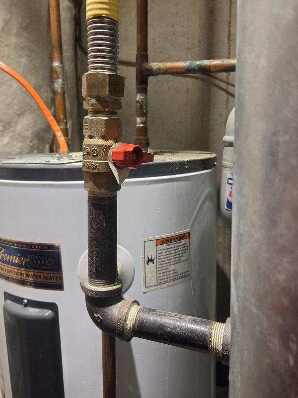 Conducted on-site evaluation of existing air conditioning system to provide replacement estimate. Inspected current HVAC control board and wiring configuration, documenting terminal connections and electrical components for proper system sizing and compatibility assessment. Photographed existing utility installations including water heater connections and mechanical room layout to ensure adequate clearance and proper placement for new equipment installation.