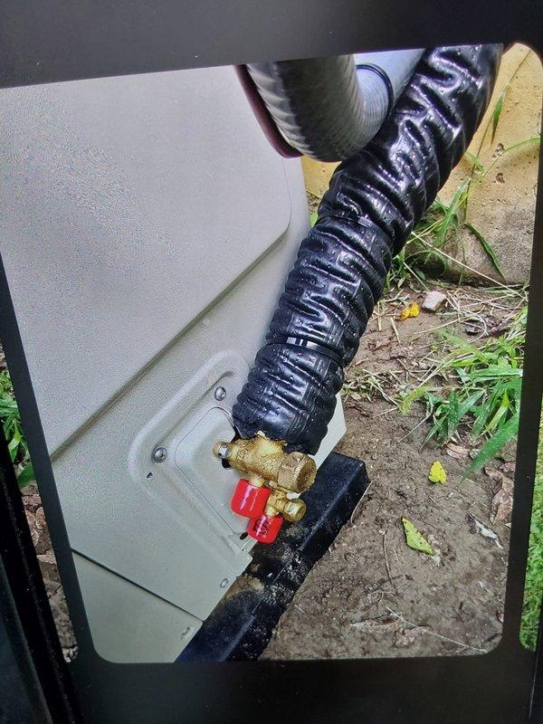 Completed inspection correction callback for outdoor condensing unit. Installed A2L refrigerant locking caps (5/16") on service port valves to meet code compliance requirements. Documented installation with photographs for inspector approval.