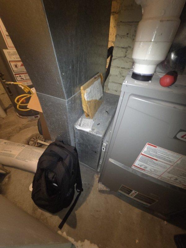 Conducted comprehensive assessment of existing HVAC system in basement mechanical room for equipment replacement estimate. Evaluated current furnace unit, ductwork configuration, and associated components including water heater installation. Documented existing equipment conditions, spatial layout, and utility connections through detailed photography to support replacement specifications and system design recommendations.