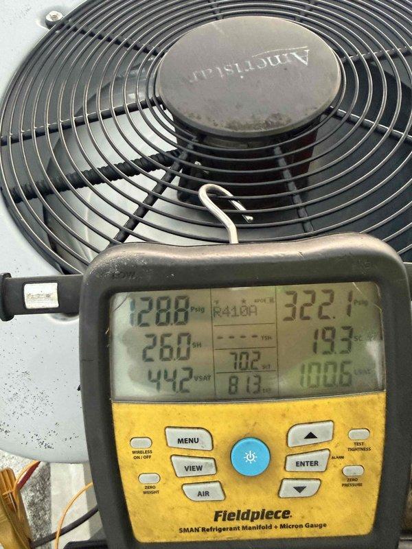 # Evaporator Coil Replacement - Commercial HVAC System

Responded to commercial HVAC system requiring evaporator coil replacement. Upon arrival, performed comprehensive diagnostic assessment of the unit to verify coil failure and determine system operating parameters.

Conducted temperature measurements throughout the system using calibrated digital thermometer, documenting supply air temperatures and verifying inadequate cooling performance. Initial readings confirmed system was operating at 93.6°F, indicating compromised heat transfer capabilities consistent with failed evaporator coil.

Connected refrigerant manifold gauges to the Armstrong condenser unit to evaluate system pressures and temperatures across both high and low sides. Recorded operating pressures of 322.7 PSI on high side and detailed superheat/subcooling calculations. Measurements indicated suction pressure of 70.2 PSI with corresponding saturation temperatures, confirming degraded coil performance affecting refrigera
