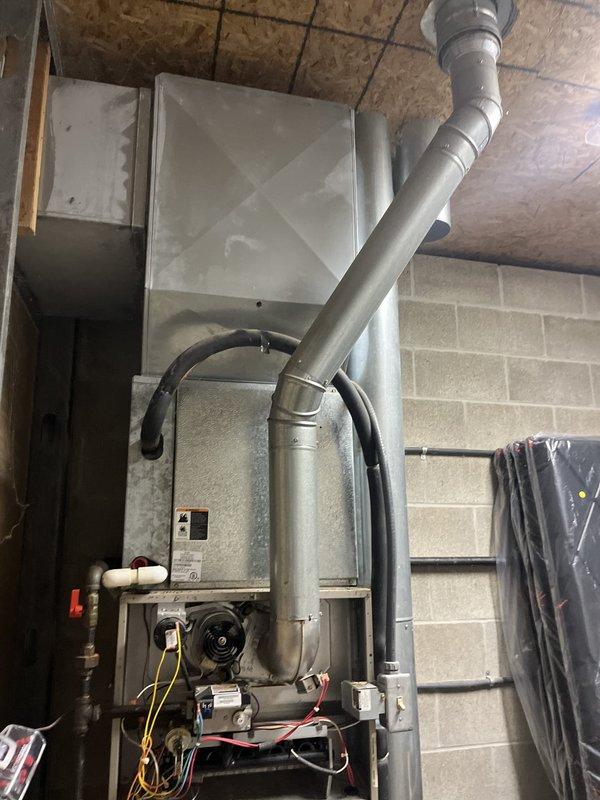 Conducted comprehensive evaluation of 22-year-old commercial HVAC system exhibiting significant water damage and failed blower motor assembly. System assessment revealed deteriorated furnace unit with compromised internal components requiring complete replacement rather than repair. Documented existing installation configuration including ductwork connections, electrical service panel circuits, venting arrangements, and plumbing interfaces to facilitate accurate replacement specifications and ensure proper system sizing for the application.