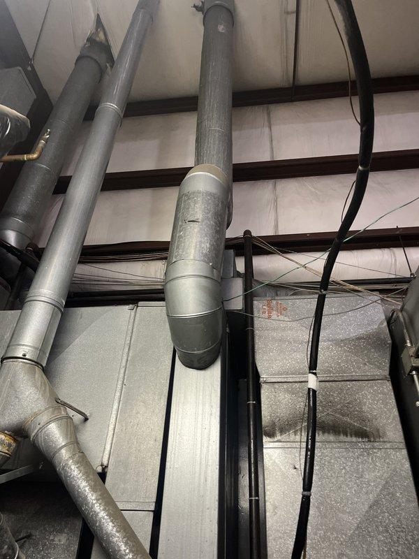 Conducted comprehensive replacement estimate for commercial HVAC system including two air conditioning units and three furnaces in response to another contractor's recommendation for equipment replacement. Performed thorough inspection of existing basement-mounted furnace units with associated ductwork systems and overhead mechanical installations, documenting current equipment condition and configuration through detailed photography. Assessed mechanical room layout, existing ductwork infrastructure, electrical connections, and spatial requirements necessary for new equipment installation to provide accurate replacement specifications.
