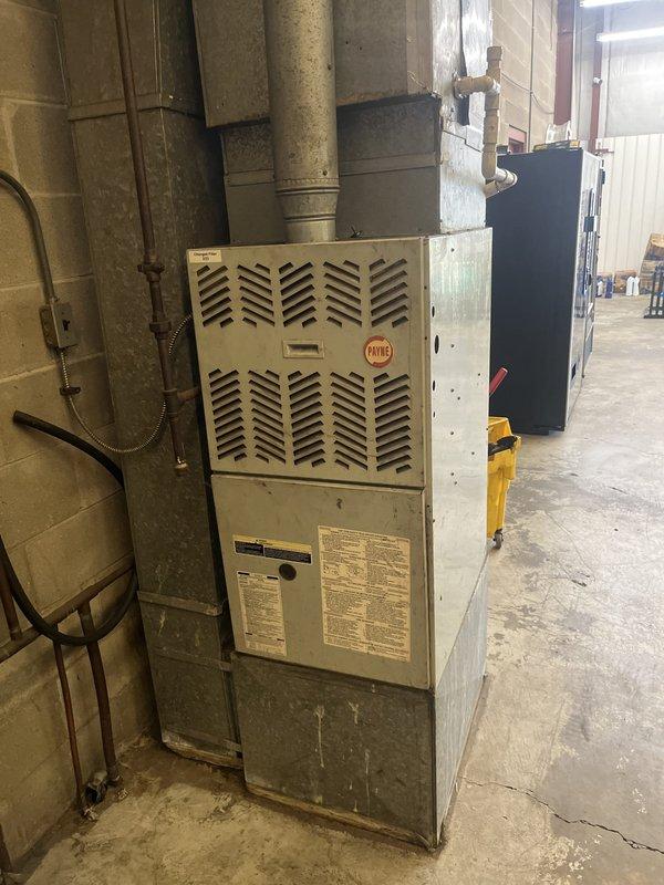 Conducted on-site evaluation for mini split system installation in commercial basement utility space to replace existing non-functional HVAC equipment. Assessed mechanical room layout, existing ductwork configuration, and available mounting locations for indoor and outdoor mini split components. Documented current furnace unit, vertical duct system, and electrical infrastructure to determine optimal placement and installation requirements for new ductless mini split system.
