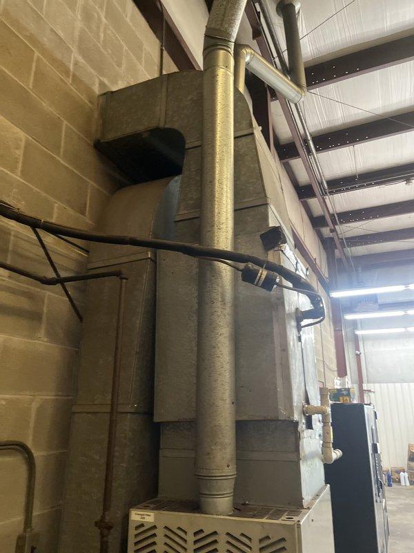 Conducted on-site evaluation for mini split system installation in commercial basement utility space to replace existing non-functional HVAC equipment. Assessed mechanical room layout, existing ductwork configuration, and available mounting locations for indoor and outdoor mini split components. Documented current furnace unit, vertical duct system, and electrical infrastructure to determine optimal placement and installation requirements for new ductless mini split system.