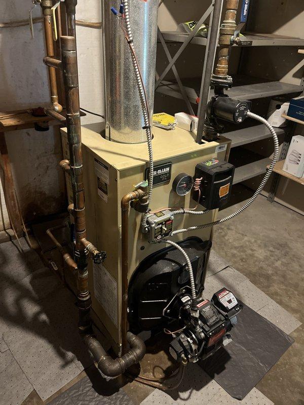 Conducted estimate for complete boiler removal and replacement with new HVAC system for residential property. Inspected existing oil-fired boiler with expansion tank, circulator pump, and oil burner assembly, which is currently functioning properly and was updated approximately three years ago. Assessed existing copper piping configuration, electrical connections, and all associated components including pressure gauges, control valves, and safety devices to determine scope of work for full system replacement throughout the residence.