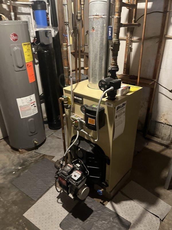 Conducted estimate for complete boiler removal and replacement with new HVAC system for residential property. Inspected existing oil-fired boiler with expansion tank, circulator pump, and oil burner assembly, which is currently functioning properly and was updated approximately three years ago. Assessed existing copper piping configuration, electrical connections, and all associated components including pressure gauges, control valves, and safety devices to determine scope of work for full system replacement throughout the residence.