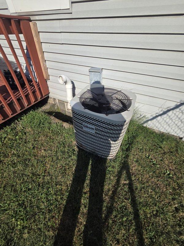 Conducted comprehensive HVAC system evaluation for complete replacement estimate. Assessed existing Rheem condenser unit positioned on ground-level installation without proper pad, along with 80k BTU Bryant furnace system in basement upflow configuration. Documented system specifications including 2.5-ton single-phase condenser, existing 3/4" x 3/8" refrigerant line set, 2" PVC flue venting, and calculated required airflow at 1,776 CFM for proper system sizing and ductwork configuration of 8x12 and 8x14 dimensions.