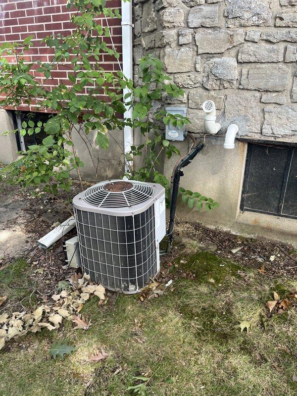 Completed comprehensive assessment of existing HVAC system for full replacement estimate due to equipment age. Evaluated indoor furnace unit located in basement with access panel removed to inspect internal components including blower assembly, heat exchanger, control board, wiring harnesses, and copper refrigerant lines. Assessed outdoor air conditioning condenser unit positioned between building exterior walls, noting weathered condition and operational status. Documented current system configuration including ductwork connections, electrical service, filter rack setup with 16x25x1 filter size, and refrigerant line routing. Provided detailed replacement recommendations for both heating and cooling equipment to address age-related concerns and ensure continued reliable operation.