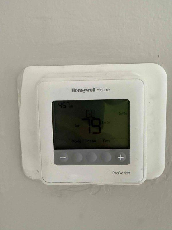 Completed commercial HVAC system installation including Bryant GA4SAN524 air conditioning unit relocated to ground level, BCRMA2124S3N3 water fan coil unit, new lineset with flush procedure, and Honeywell Home ProSeries thermostat. Connected new equipment to existing water supply with appropriate pipe and fittings, obtained required permit, and verified system operation with supply air temperature reading of 62.8°F and thermostat functioning properly at 79°F ambient.