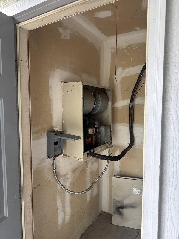 Responded to no cooling call at commercial property. Upon arrival, located HVAC equipment in utility closet and inspected electrical system. Found tripped circuit breaker at electrical panel serving the air conditioning unit. Reset breaker and verified power restoration to system. Unit resumed normal operation and cooling was restored.