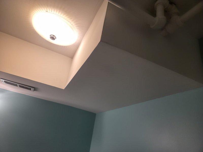 Conducted site assessment for heat pump replacement estimate on Unit 6 at commercial facility. Documented existing HVAC system configuration including ceiling-mounted supply vent location, electrical panel circuit identification for A/C unit, and verified electrical service capacity for replacement equipment installation.