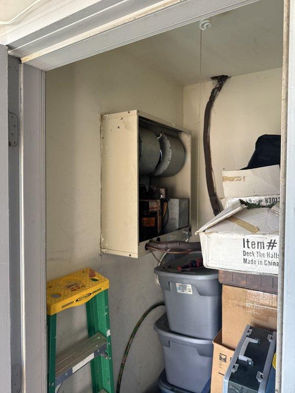 Responded to no cooling complaint at commercial apartment unit. Upon arrival, located HVAC system in utility closet and verified electrical circuit breaker panel for proper power supply to air conditioning system. Inspected breaker labeled for furnace/AC circuit and documented panel configuration for unit troubleshooting.