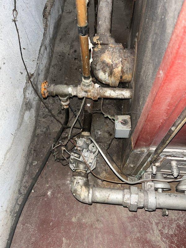 Conducted comprehensive assessment of existing boiler system in commercial 4-family building for replacement estimate. Inspected deteriorated mechanical assembly revealing heavily corroded galvanized and copper piping, aged valves with significant rust and oxidation, compromised electrical connections, and overall system infrastructure showing extensive wear requiring full replacement to ensure safe and reliable heating operation.