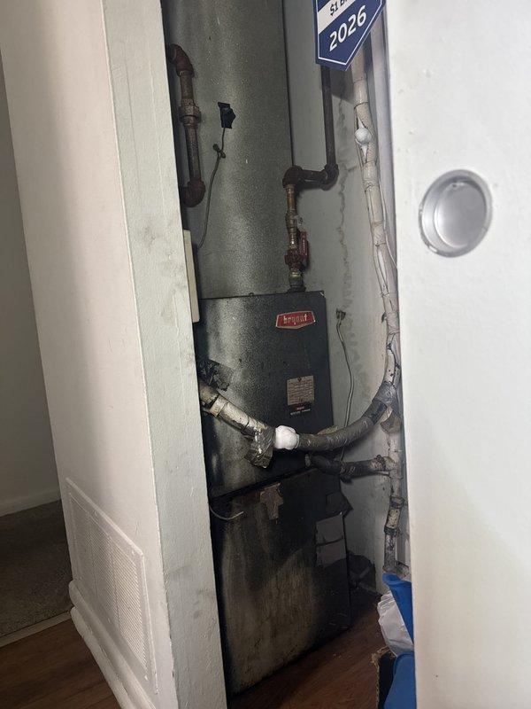 Responded to no cooling complaint at commercial property. Inspected rooftop condenser unit and found system operational upon arrival. Verified unit power supply, checked electrical disconnect, and confirmed compressor and condenser fan motor functionality. Documented equipment condition with exterior cabinet showing normal weathering consistent with outdoor installation. System restored to normal cooling operation.