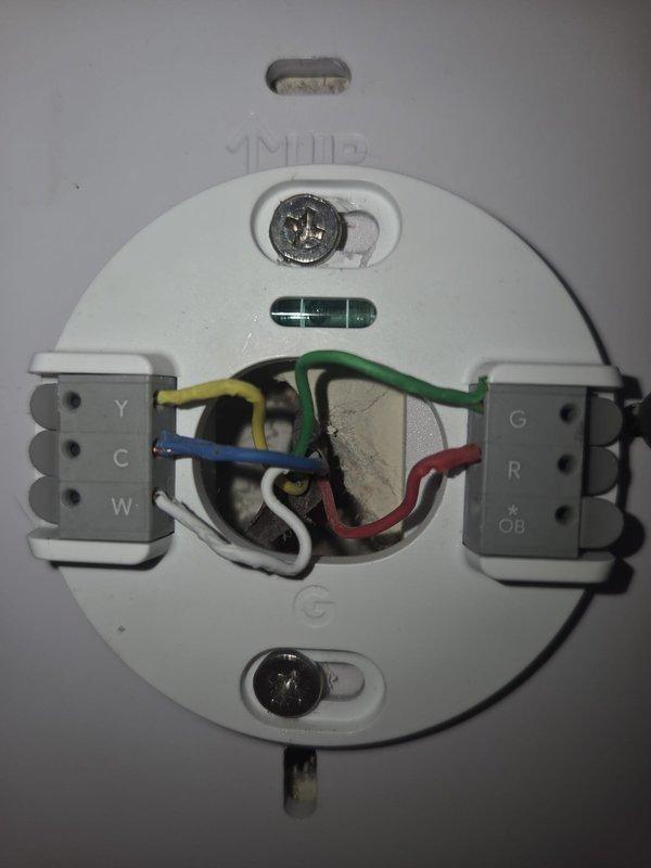 Performed comprehensive estimate for complete HVAC system replacement of air conditioning unit and gas furnace, both exceeding 20 years of service life. Documented existing electrical panel configuration showing dedicated circuits for HVAC equipment and photographed thermostat wiring connections at base plate to assess compatibility requirements for new system installation.