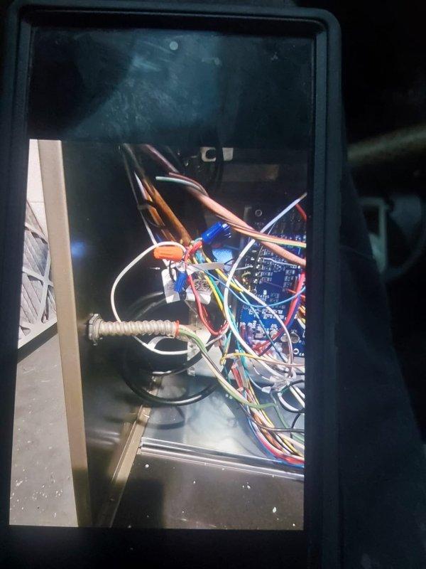Responded to installation callback to address inspection violation regarding accessory wiring for furnace. Corrected MC connector installation at 90-degree bend to comply with manufacturer specifications per NEC 110.3B. Verified all electrical connections within control panel are secure and properly terminated with appropriate wire nuts and connectors.