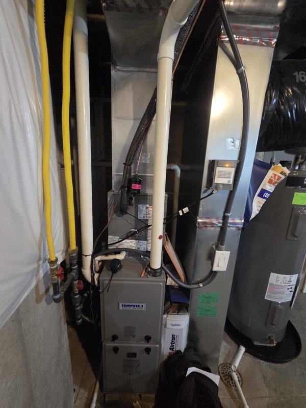 Conducted site evaluation for whole house dehumidifier and humidifier installation on existing Tempstar furnace system. Assessed mechanical room layout, existing HVAC equipment configuration, available space for IAQ equipment integration, and electrical requirements. Documented current system setup including ductwork connections and utility locations to prepare comprehensive estimate for indoor air quality equipment addition.