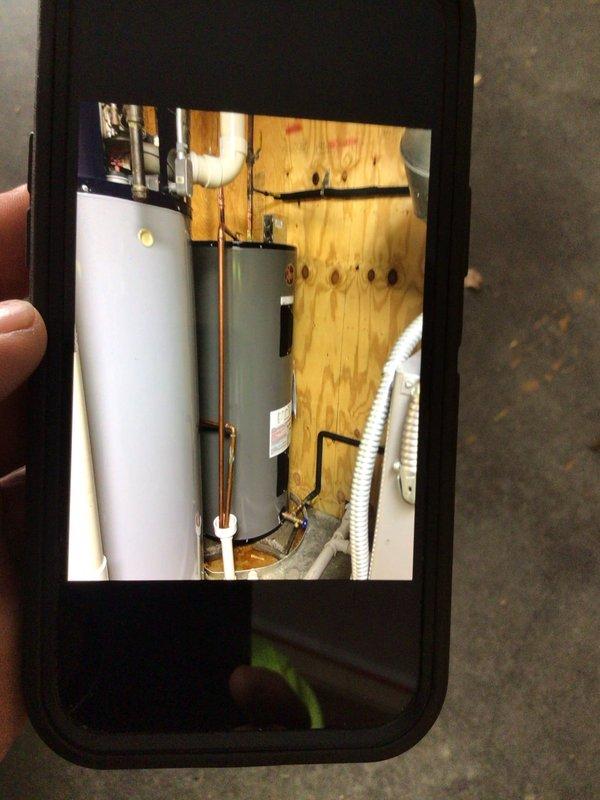 Replaced 75-gallon electric water heater holding tank on geothermal system. Disconnected and removed existing tank, installed new unit with proper copper piping connections, PVC discharge lines, and electrical wiring. Verified all plumbing connections for proper operation and system functionality upon completion.