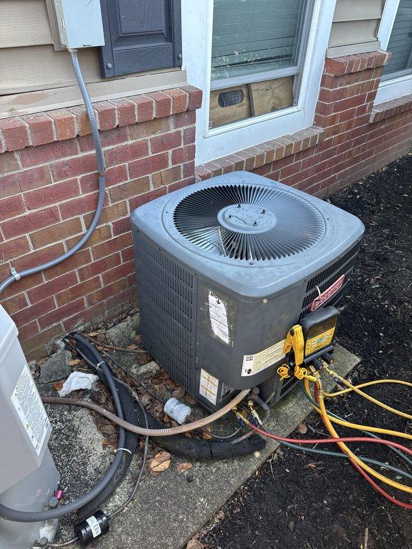 Performed leak check on residential air conditioning system using refrigerant recovery and diagnostic equipment. Connected manifold gauges to outdoor condensing unit and conducted pressure testing to identify potential refrigerant leaks in the system. Verified electrical disconnect operation at breaker panel during diagnostic procedure.