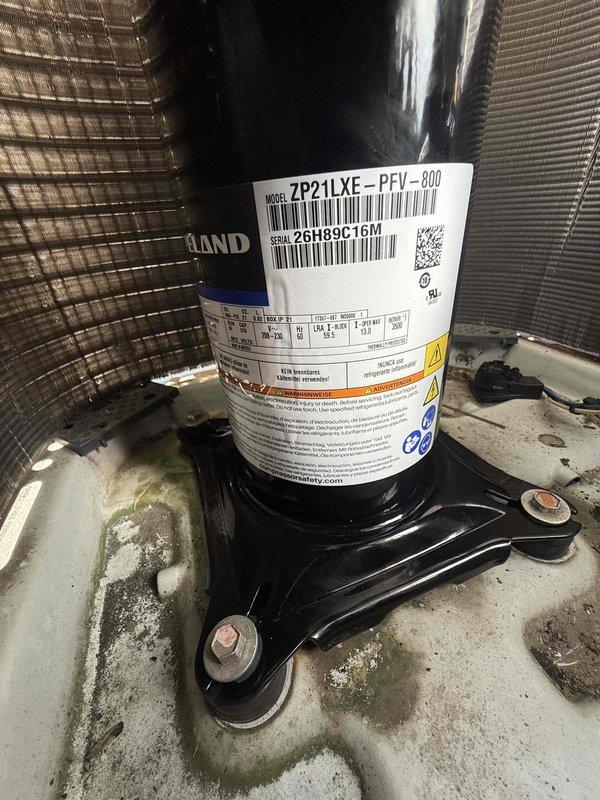 Returned to site to complete compressor replacement on commercial HVAC unit. Removed failed compressor and installed new ZP21LXE-PFV-800 scroll compressor with serial number 26H89C16M. Secured unit to mounting base with proper brackets and hardware. Evacuated system, charged with 10.50 ounces of refrigerant per manufacturer specifications, and verified proper operation of all components.