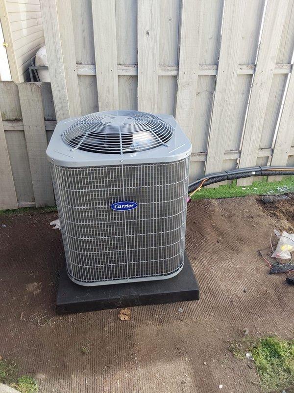 Completed full HVAC system replacement at commercial property, relocating outdoor condensing unit away from dryer vent for proper clearance and ventilation. Installed new Carrier condensing unit (model 800SB36070) on composite pad with proper electrical disconnect and whip, new Bryant furnace (model GA4SAN524), and Carrier evaporator coil (model CVAVA2414) with complete ductwork connections. Removed and disposed of existing equipment per EPA refrigerant recovery specifications, installed solid disconnect box, obtained necessary permits, and verified all components operating within manufacturer specifications upon system startup.