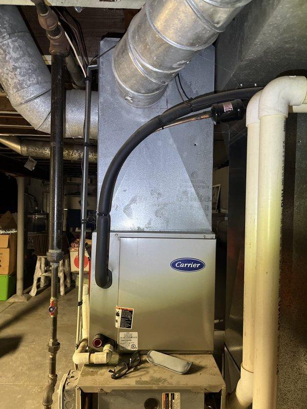 Completed estimate for replacement of 24-year-old Carrier HVAC system including both air conditioning unit and furnace. The existing AC unit is currently inoperative, and customer has requested pricing for complete system replacement of both components. Documented existing equipment configuration including ductwork, condensate drainage, and exterior condenser placement for replacement specifications.