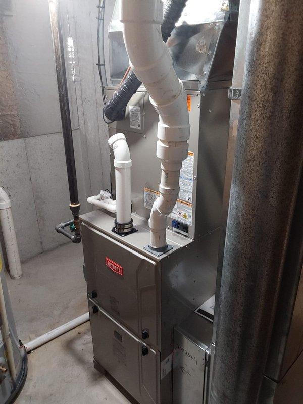 Completed full HVAC system replacement including installation of Bryant 927TA60100V21 gas furnace, Bryant 146SAN04801W 4-ton single-stage air conditioner utilizing R454B refrigerant, and CVAVA4821XMA cased vertical evaporator coil. Performed lineset nitrogen purge, RX11 flush, and pressure leak test to ensure system integrity. Installed new exterior disconnect box with fuses, replaced filter rack with new filter, and upgraded to Honeywell T6 thermostat. Reconnected all components to existing gas line, flue pipes, ductwork, and exterior electrical poles. System tested and operational.