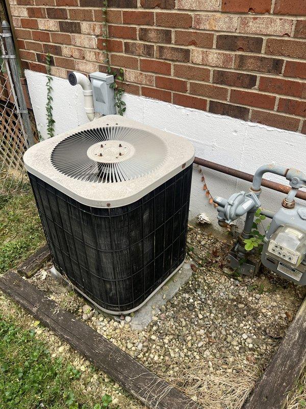 Performed estimate for replacement of 30-year-old residential air conditioning system utilizing R22 refrigerant. Unit was previously serviced for low refrigerant charge, indicating potential system leaks or efficiency loss common in aging equipment. Evaluated outdoor condenser unit positioned on gravel pad adjacent to structure, noting overall condition and accessibility for replacement. Discussed available discount programs and provided comprehensive replacement options for upgrading to modern, environmentally-compliant refrigerant system.