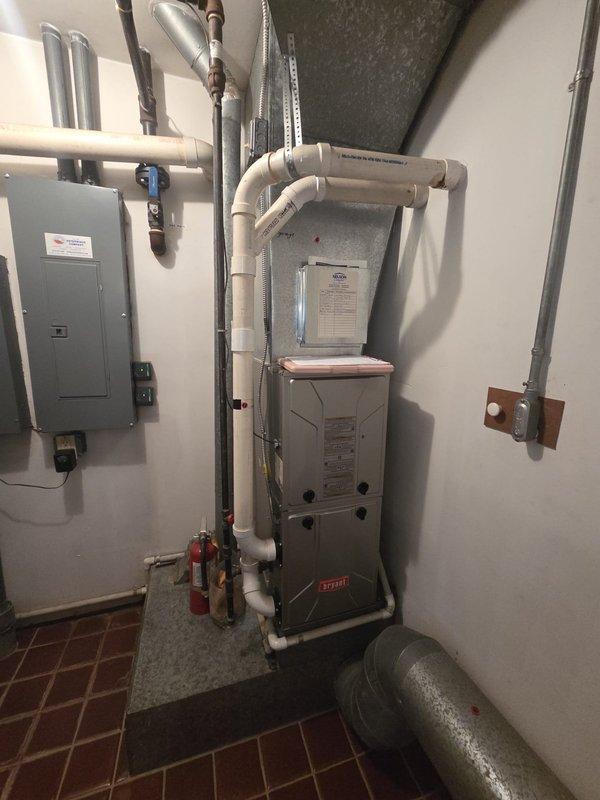 Provided replacement estimate for three gas furnace units: two Tempstar units located in the basement and one Bryant unit installed in the garage. Evaluated existing HVAC equipment including vertical furnace configuration with PVC venting system, associated ductwork, electrical connections, and refrigerant line sets. Documented current system specifications and provided comprehensive replacement options for all three furnace units to address equipment age and efficiency requirements.