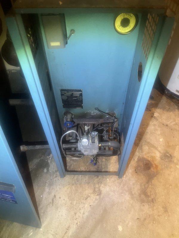 Conducted comprehensive boiler system evaluation in mechanical room. Inspected existing hydronic heating infrastructure including copper supply and return piping with insulation, multiple zone valves, gate valves, and circulator pump assembly housed in blue cabinet enclosure. Assessed piping configuration, valve operation, and overall system condition to provide replacement estimate for aging boiler equipment.