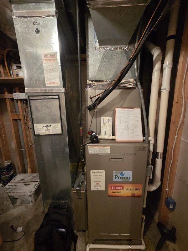 Performed a replacement estimate for the existing air conditioner and gas furnace system. Inspected the outdoor condensing unit, where the control compartment showed heavy dust, cobwebs, and aged wiring and insulation consistent with long-term weathering, and evaluated the Bryant Evolution Plus 90i gas furnace, which showed no visible frost, rust, or major damage. Documented equipment conditions with photos and reviewed replacement options with the customer.