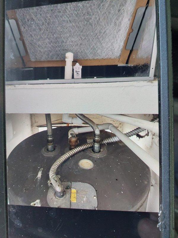 Installed a new 1.5-ton, 14 SEER condensing unit on a new pad, paired with a Bryant FMA5X18 air handler with 8 kW electric heat in the closet. Connected the existing supply and return with new sheet metal, flushed the lineset, and installed a disconnect and fuses. Recovered and disposed of the existing equipment per EPA specifications.