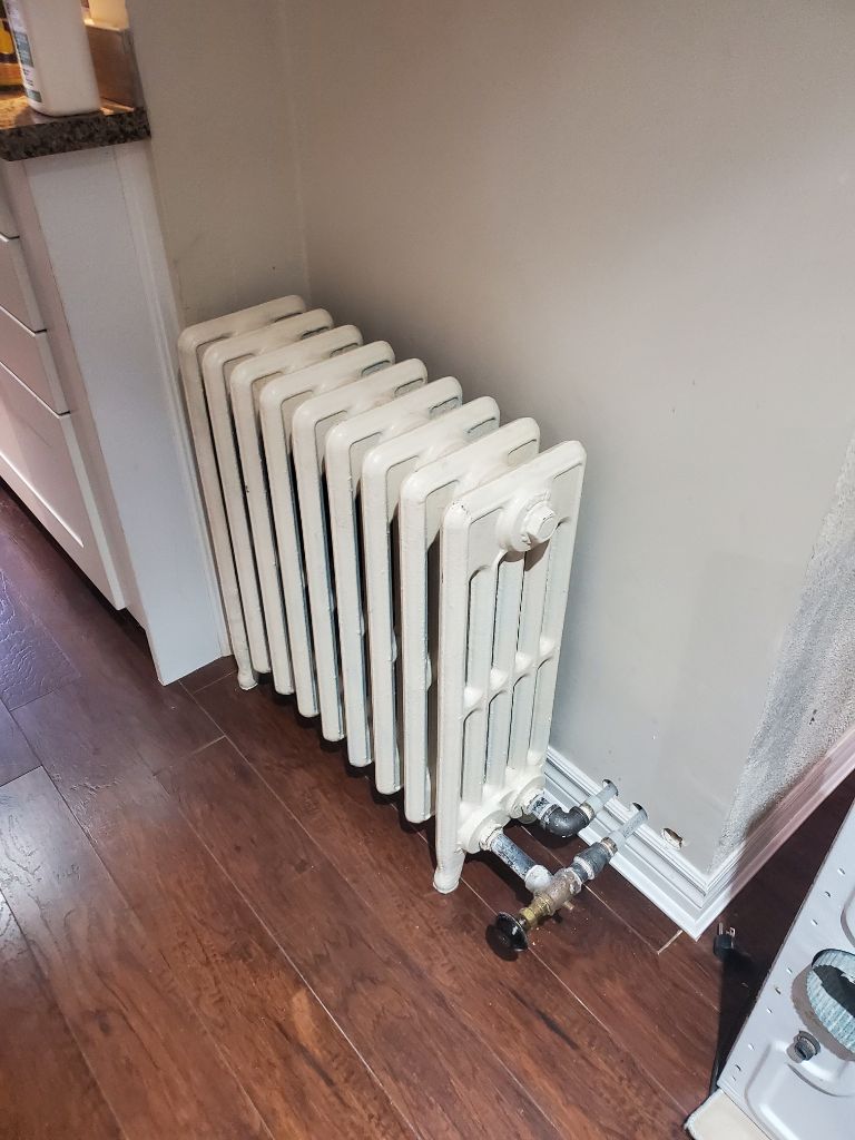 Replaced heating main in basement to allow for ceiling height to be raised. New heating lines and gas supply Installed and tested.