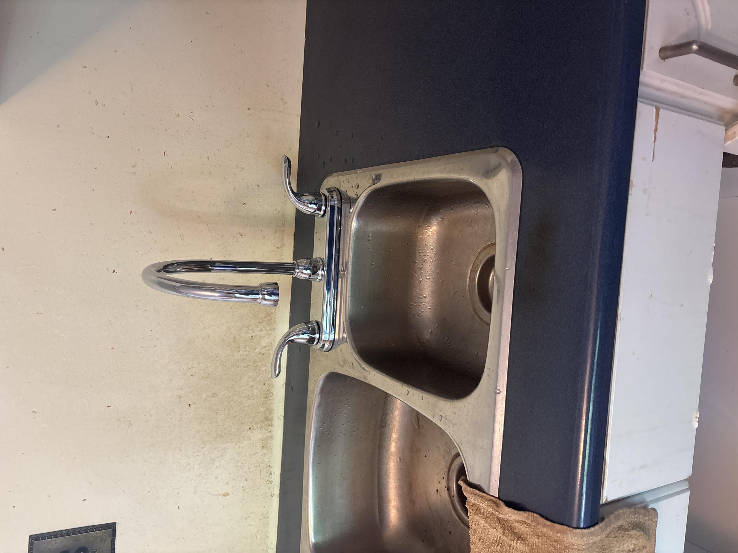 Install a customer supplied kitchen faucet