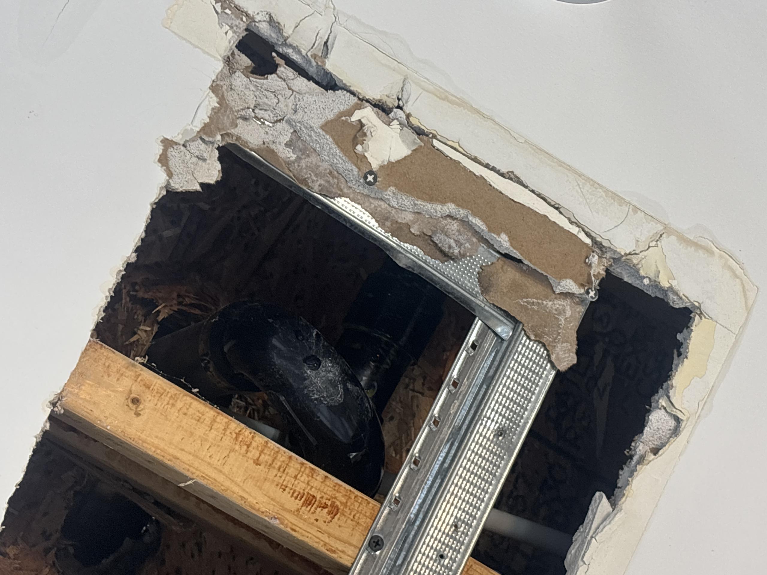 freestanding tub leaking to ceiling below