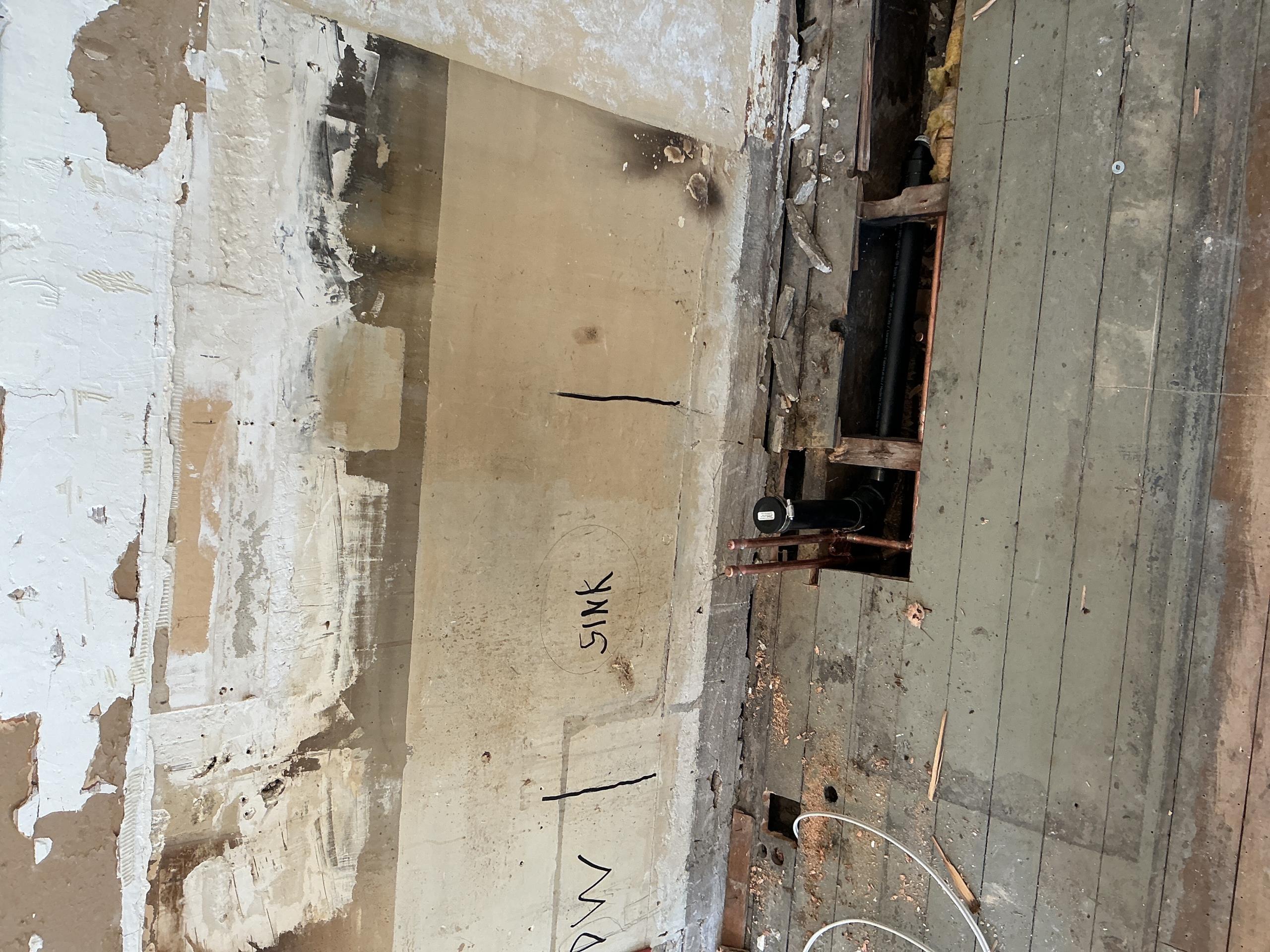 Old Toronto, ON - Reconfiguration of kitchen drain and water pipes