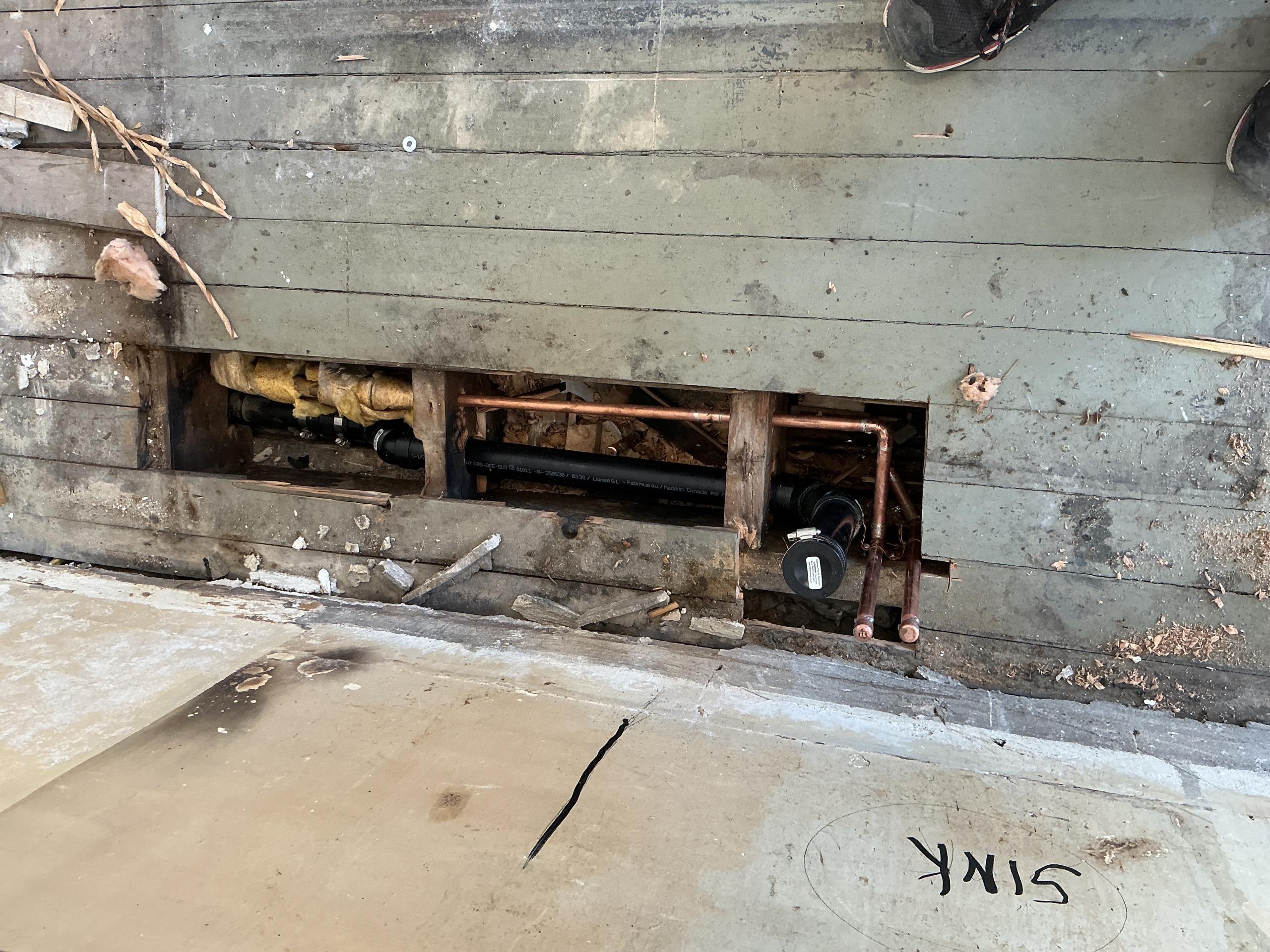 Old Toronto, ON - Reconfiguration of kitchen drain and water pipes