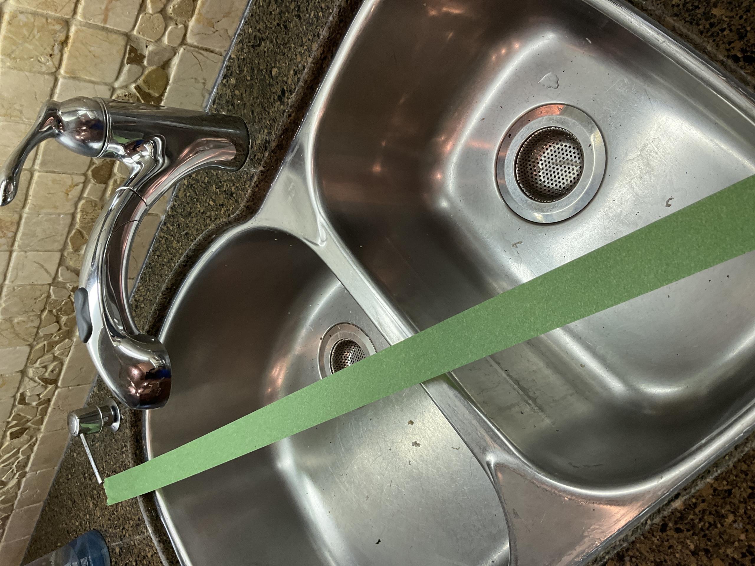 North York, ON - Repaired shower, recaulked kitchen sink