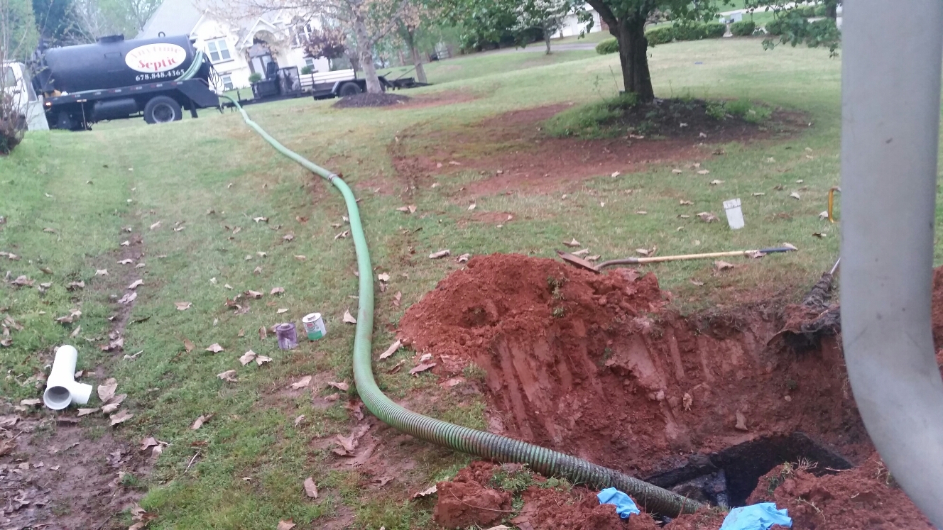 Pumped out a 1000 gallon septic tank and replaced tee baffle 