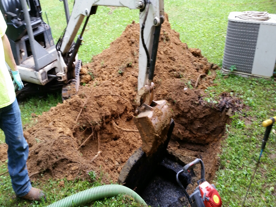 Pumped out a 1000 gal septic tank over full inspected field lines 