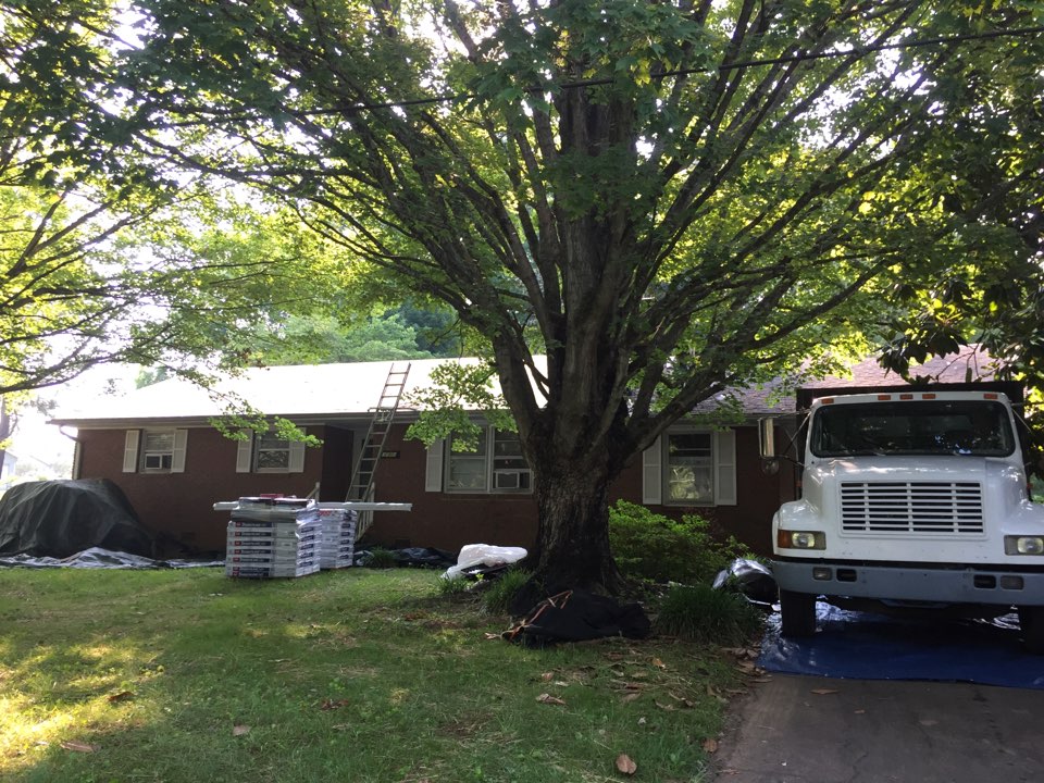 Roof replacement, we are getting started on a roofing job today by tearing off all day old shingles down to the roof deck