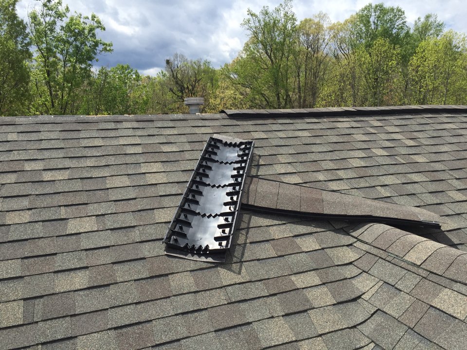 Roof repair due to  improper roof installation, this architectural roof with ridge vent was installed less than two years ago and it's blowing off because the roofer did not install ridge vent with ring shank nails. This is why the cheapest Roofer is not the best one, when you get a roofing estimate be sure that your roofer is installing your shingles correctly. The cost of repairing hey Roof improperly installed can be very costly.