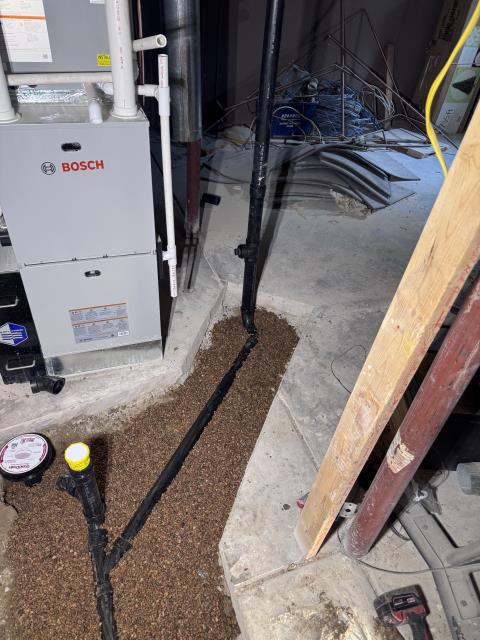 I replaced 4” piping under the slab to connect with the existing 3” vertical drop. The old basement bathroom group piping was removed and disposed of appropriately. New drain lines were routed for the underground kitchen sink, laundry connection, and emergency floor drain, including a mechanical studor vent. Piping for the basement toilet, lav sink, and shower was installed, with fixture locations confirmed with the homeowner. The main level powder room toilet drop was repiped for proper slope, a “wye” was added for a future shower line, and a vent line was capped as requested. All new piping was bedded in pea gravel and sloped correctly. The work was reviewed and approved by the customer and passed city inspection.