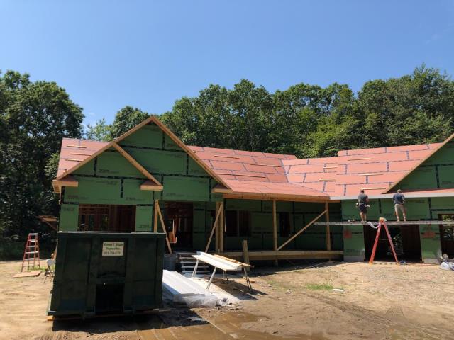 North Kingstown, RI - Measuring a new construction roof for a new GAF roof system with Standing seam metal porch roof and custom metal returns North Kingstown, RI - Measuring a new construction roof for a new GAF roof system with Standing seam metal porch roof and custom metal returns