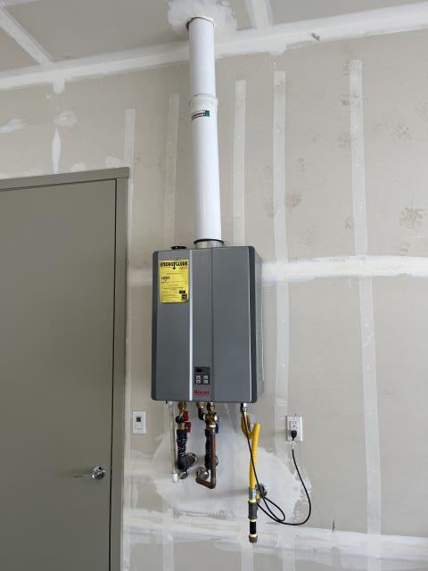 Rinnai tankless water heater leaking from cold side inlet service valve brass union due to a crack. 
Removed service valve & installed a temporary water heater flex line until new service valve is ordered &  installed.