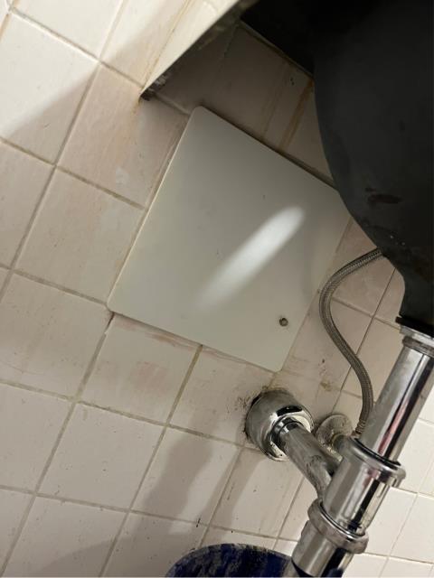 I removed the sink in the women’s restroom and cut open the wall. I found a gate valve that went straight to the outside wall hose bib that was leaking. I shut the gate valve off and found the leak outside had stopped. I advised the onsite maintenance staff that we’d like to cut the pipe and cap it off inside the wall, but they didn’t want us to do that. The on site maintenance staff asked us to just leave the valve shut off and cover it up with an access panel so they could turn the water back on if they needed to.