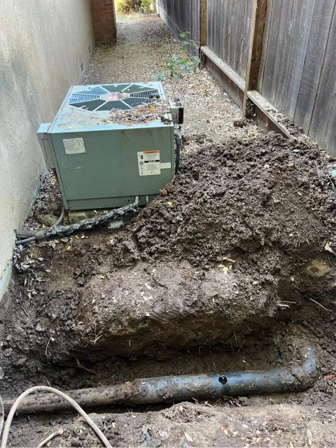 Arrived to find the sewer line clogged at the 4” abs pipe they had previously dug up and broke a hole into the top of the pipe. 
  Cut the hole big enough to get a double blade into and ran a mainline snake down the line. 
  Got the line to flow about 100-110 feet into the line after fighting through some rough pipe. Pulled back some roots on the blade and cable.  
  Ran water inside the house to test. Everything is draining at this time. 