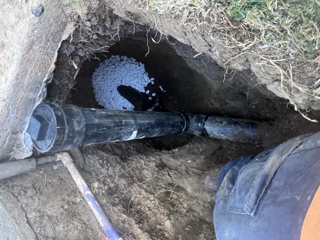 Camera line, found where line has problems, dug up next to sidewalk, removed bad section of sewer, made repairs, installed new, clean out, salted connection to clay for roots, backfield, and cleaned up all areas of work.