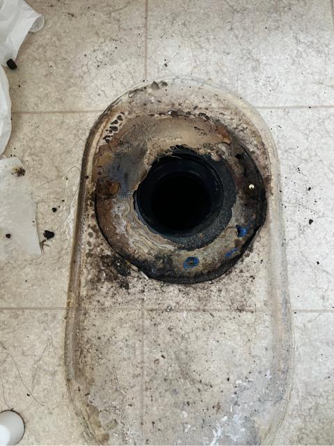 I arrived at a home to find a toilet rocking back and forth and leaking from the base when flushed. I found that the toilet was running non-stop due to a bad flapper. I removed the toilet from the flange and found that roots had eaten away the wax ring. I replaced the flex line, doubled up the wax ring, and reset the toilet with two shims to even it out. I also replaced the flapper in the toilet tank to stop the toilet from running. I filled and flushed the toilet multiple times to test it, and it is now filling and flushing without issue.