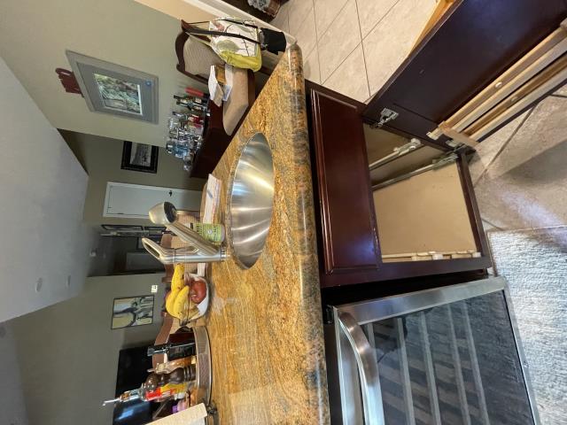 I arrived at the property and found the kitchen sink clogged. I used a kitchen snake to clear the clog, which was about 20 feet out. I tested both kitchen sinks and everything is working properly now.